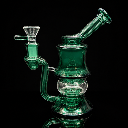 Green glass water pipe on a black background
