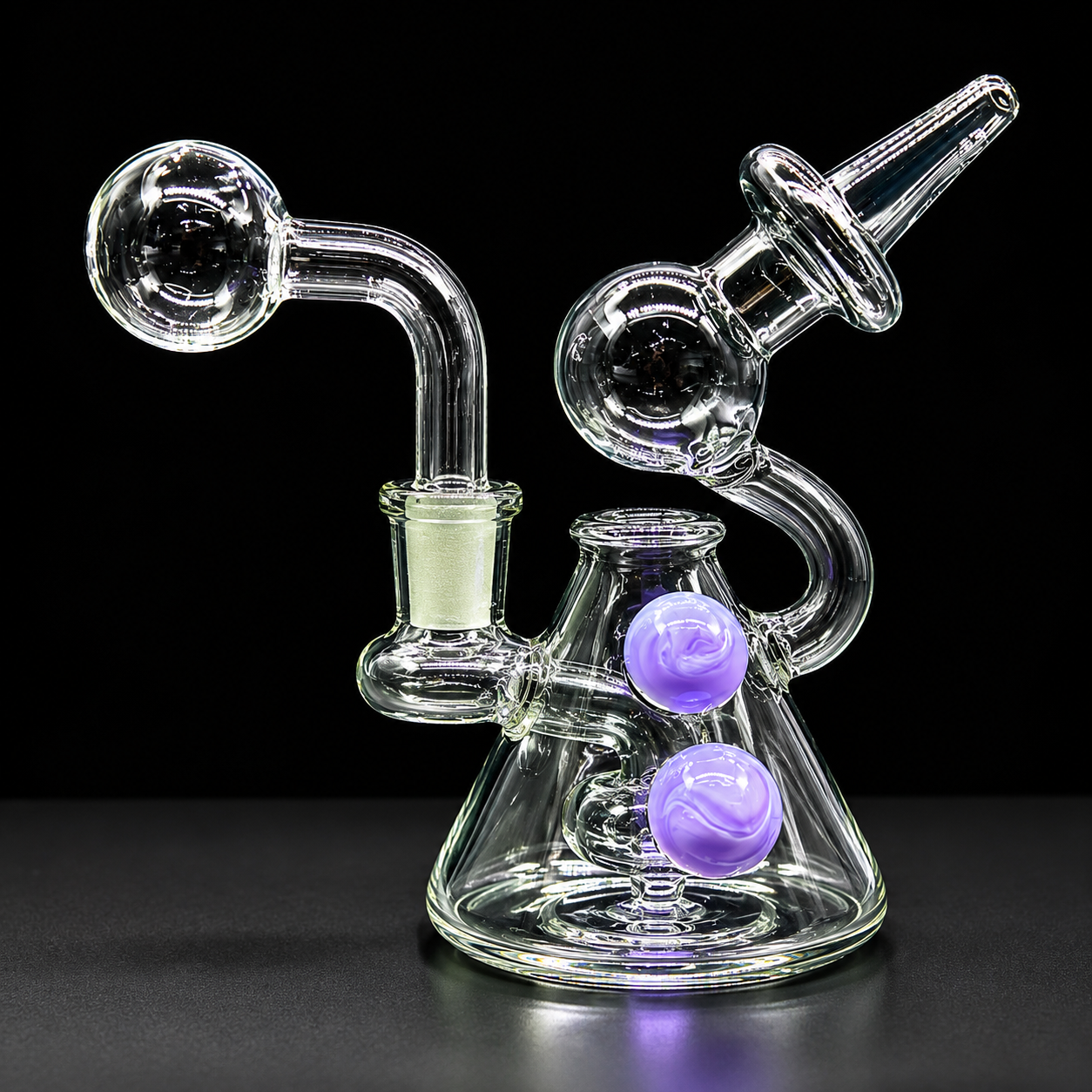 Glass smoking device with purple balls on a black background