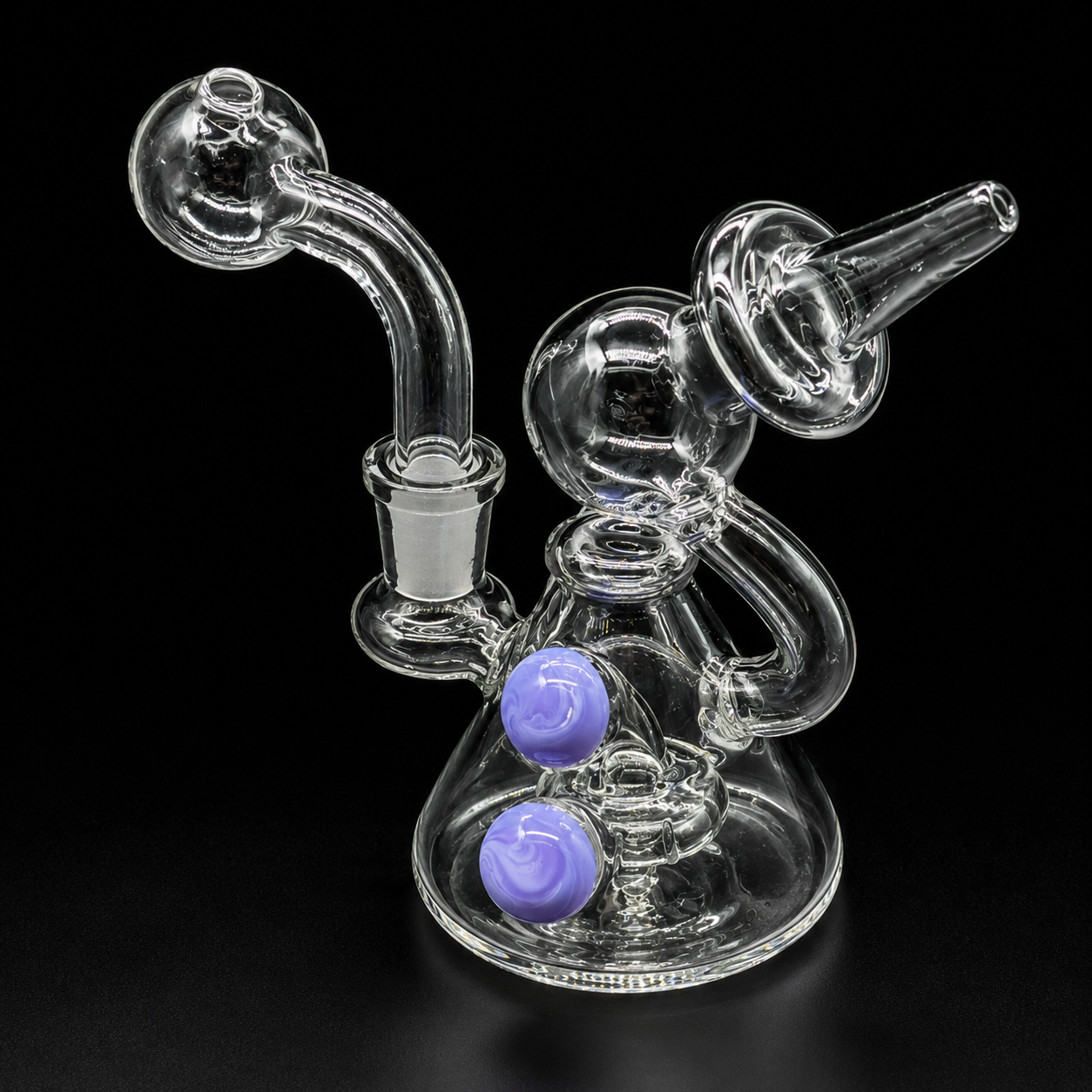 Clear glass smoking device with purple bowls on a black background