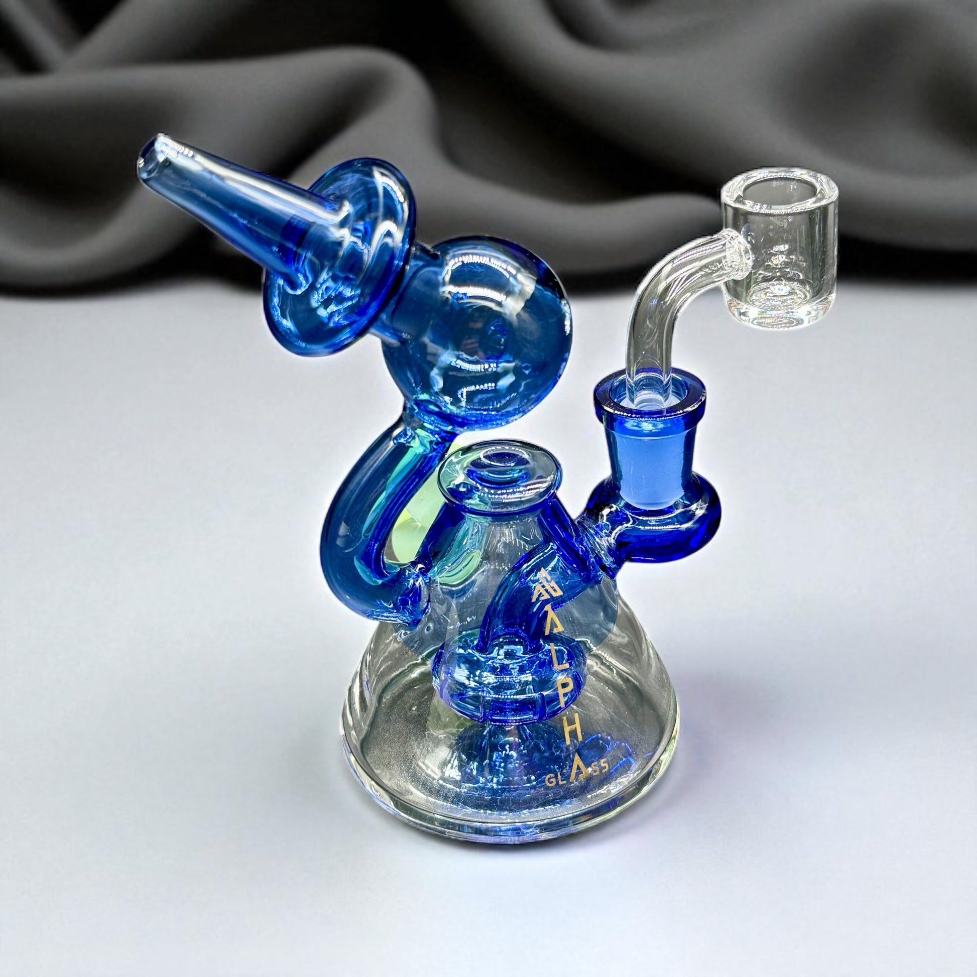 Blue glass water pipe on a white background
