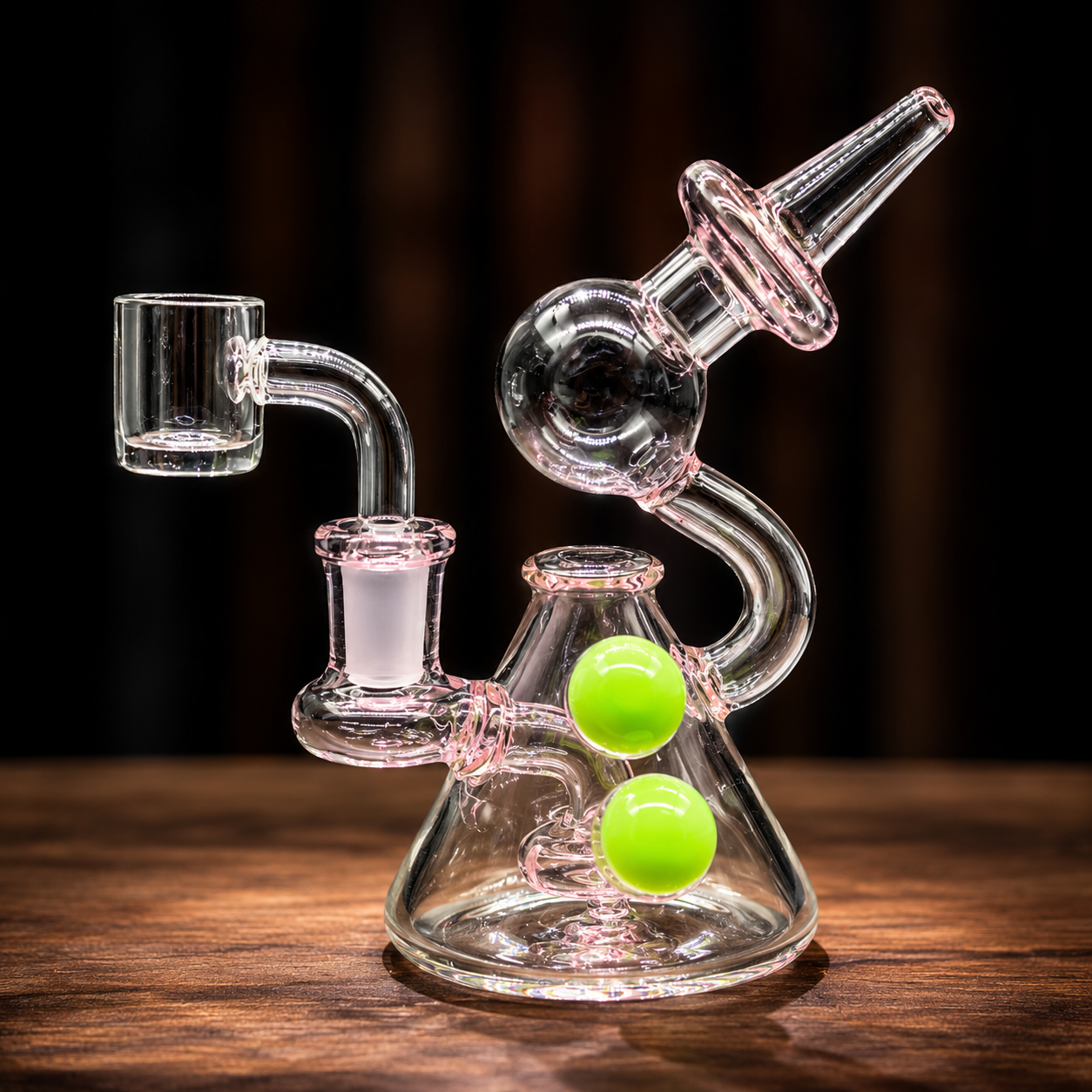 Glass smoking device with green balls on a wooden surface