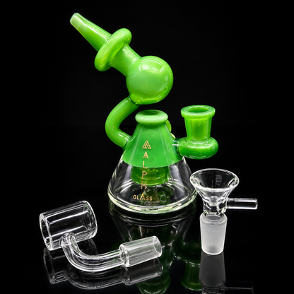 Green glass smoking device with clear components on a black background