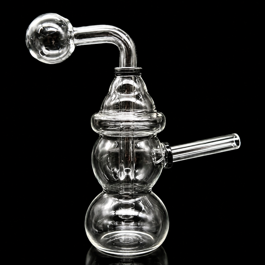 Clear glass smoking device with multiple chambers on a black background