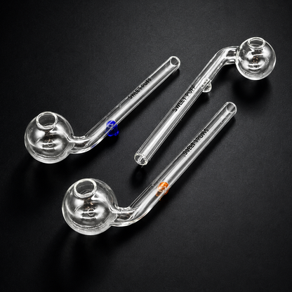 Three glass smoking pipes on a black background