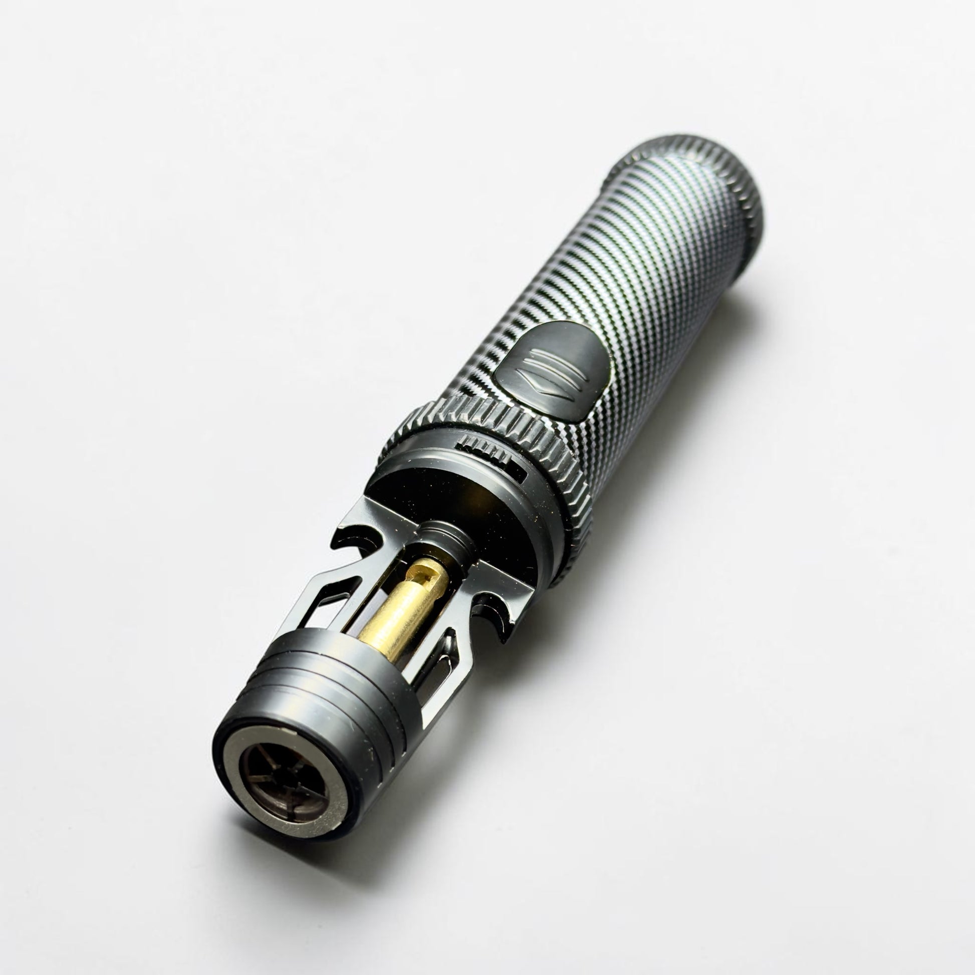Close-up of a torch lighter on a white background