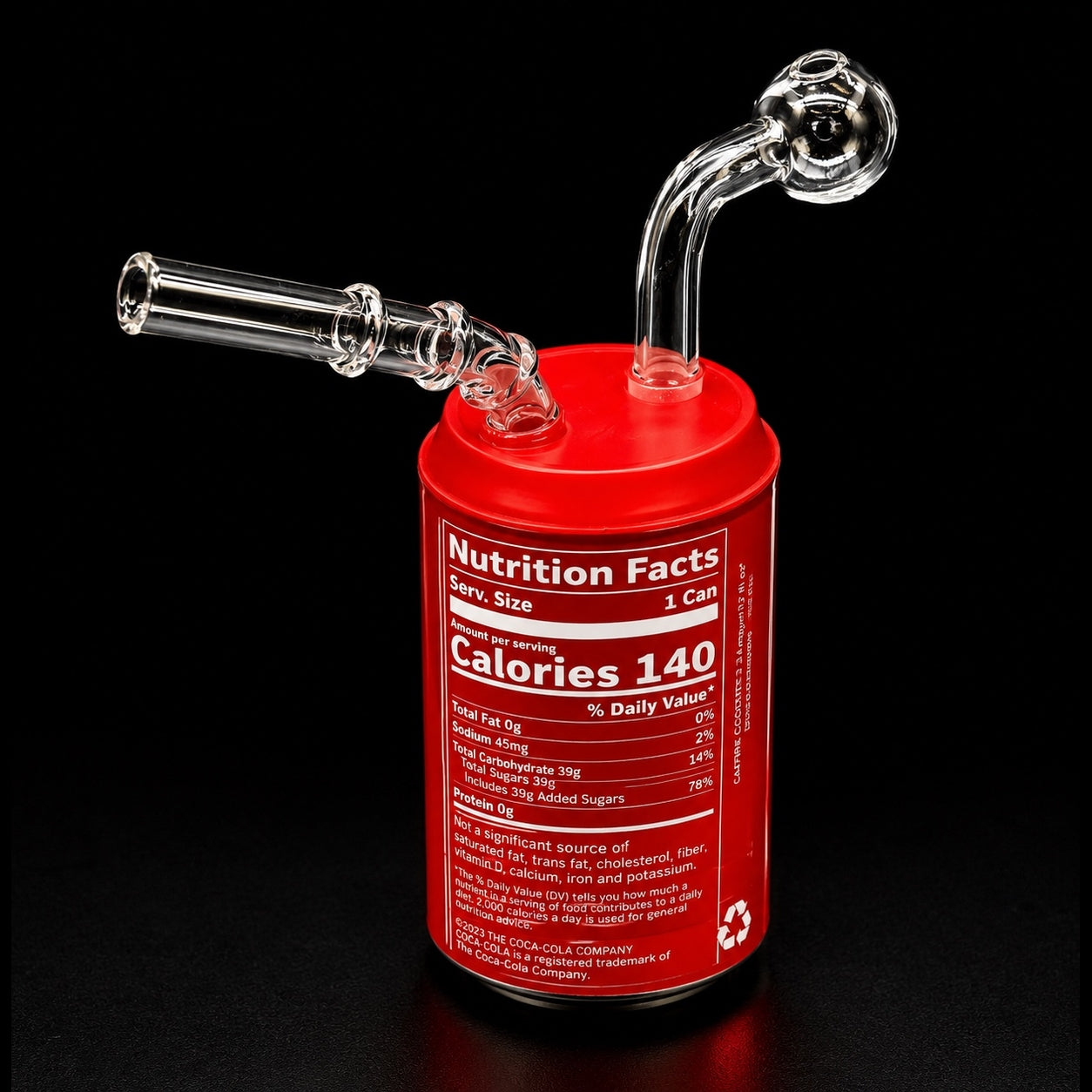 Red can-shaped glass water pipe with nutrition facts label on a black background