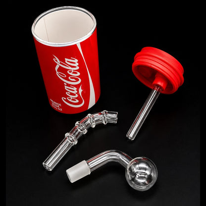 Glass smoking apparatus with a red Coca-Cola can on a black background