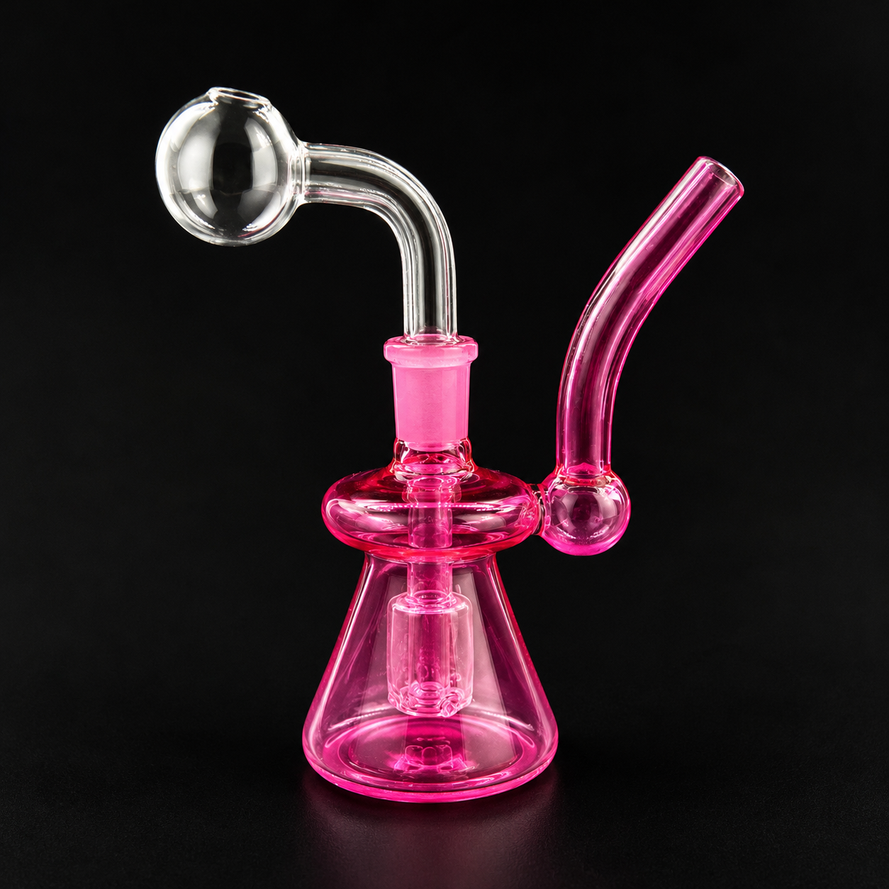 Pink glass water pipe on a black background