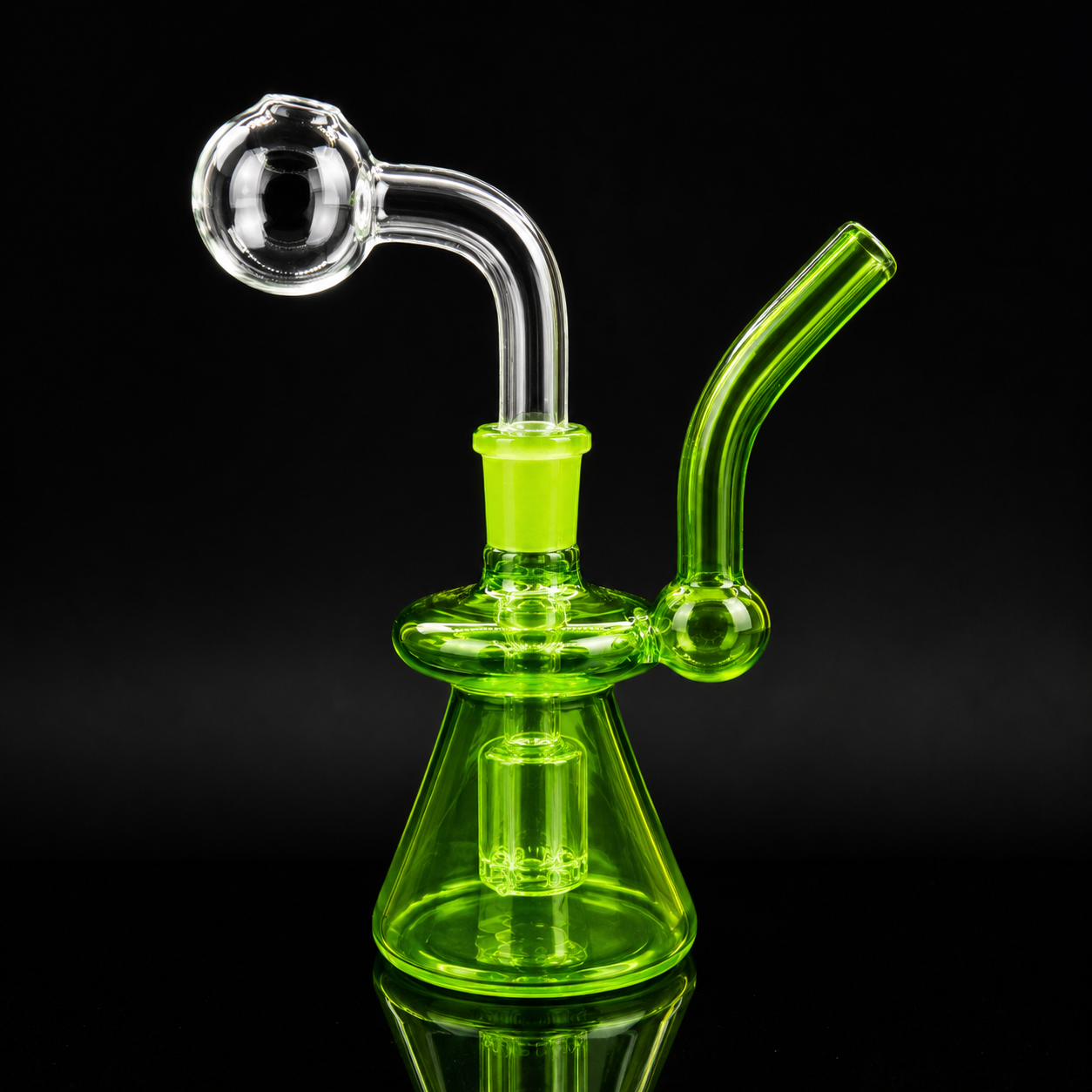 Green glass water pipe on a black background