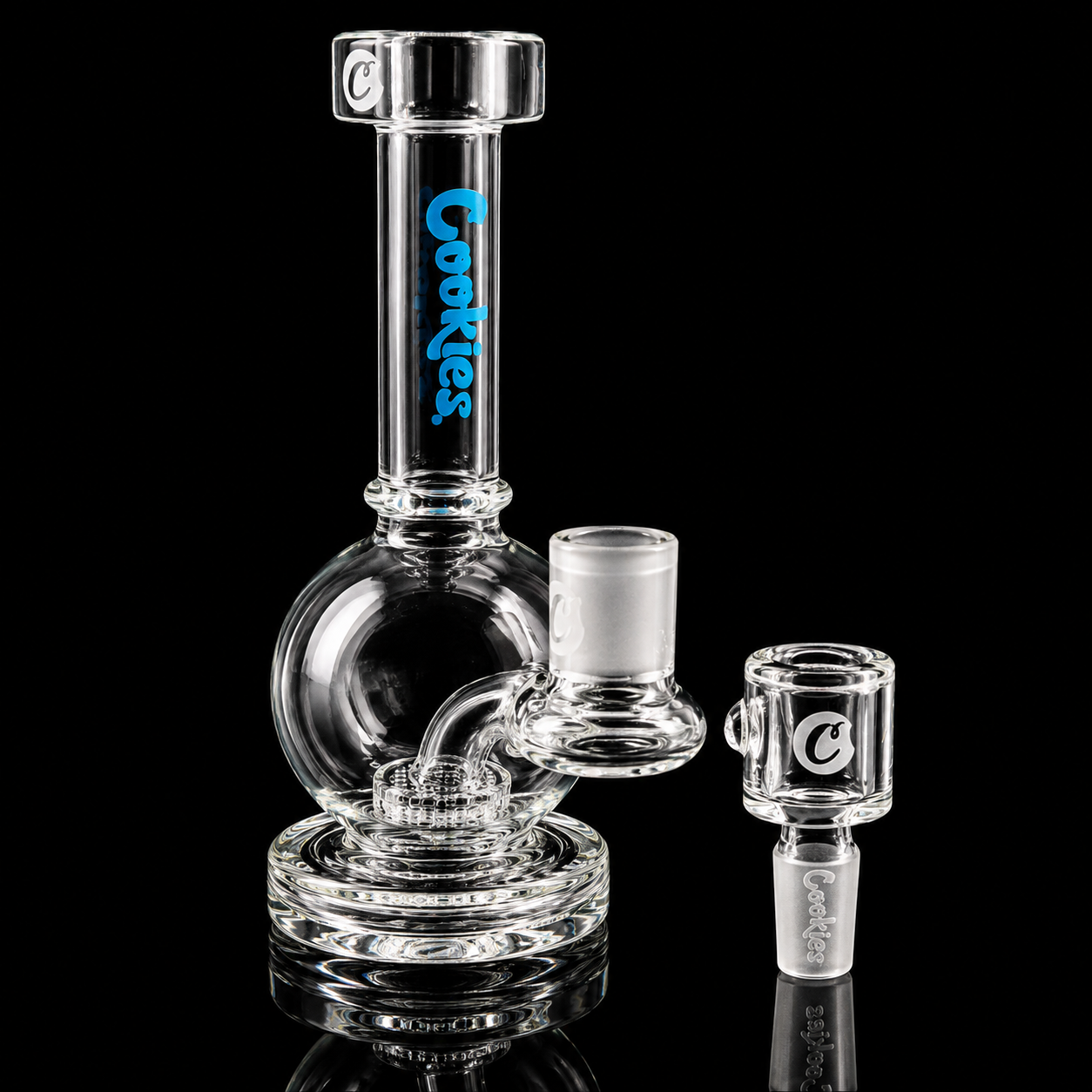 Clear glass smoking device with 'Cookies' branding on a black background