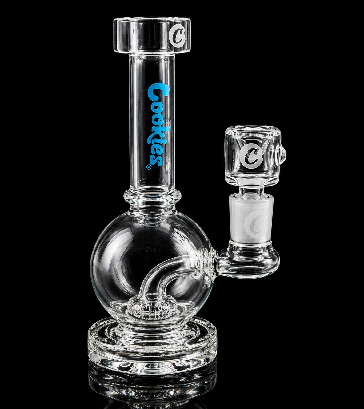 Clear glass smoking device with 'Cookies' branding on a black background
