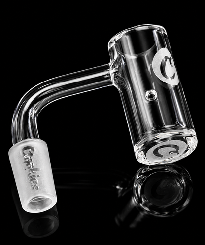 Clear glass water pipe with a curved design on a black background