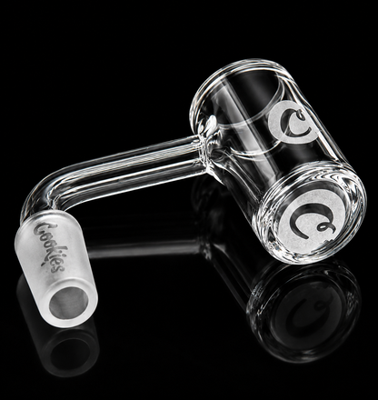 Clear glass smoking accessory with 'Cookies' branding on a black background