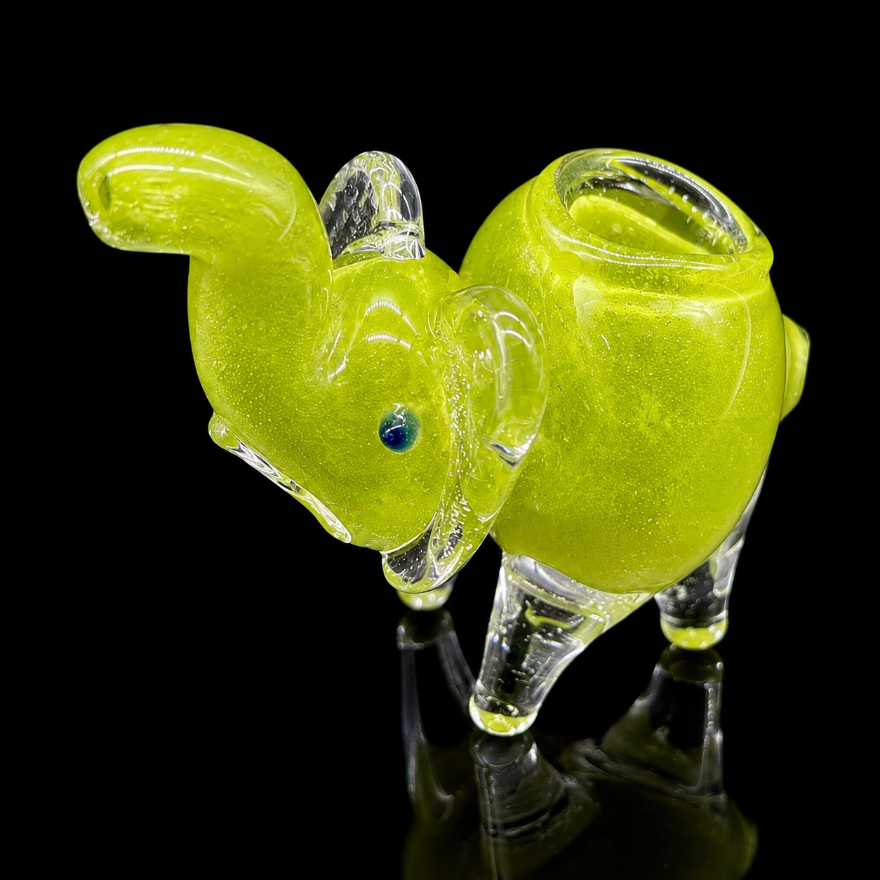 Glass smoking accessory shaped like a fish on a black background