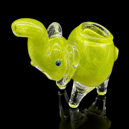 Glass smoking accessory shaped like a fish on a black background