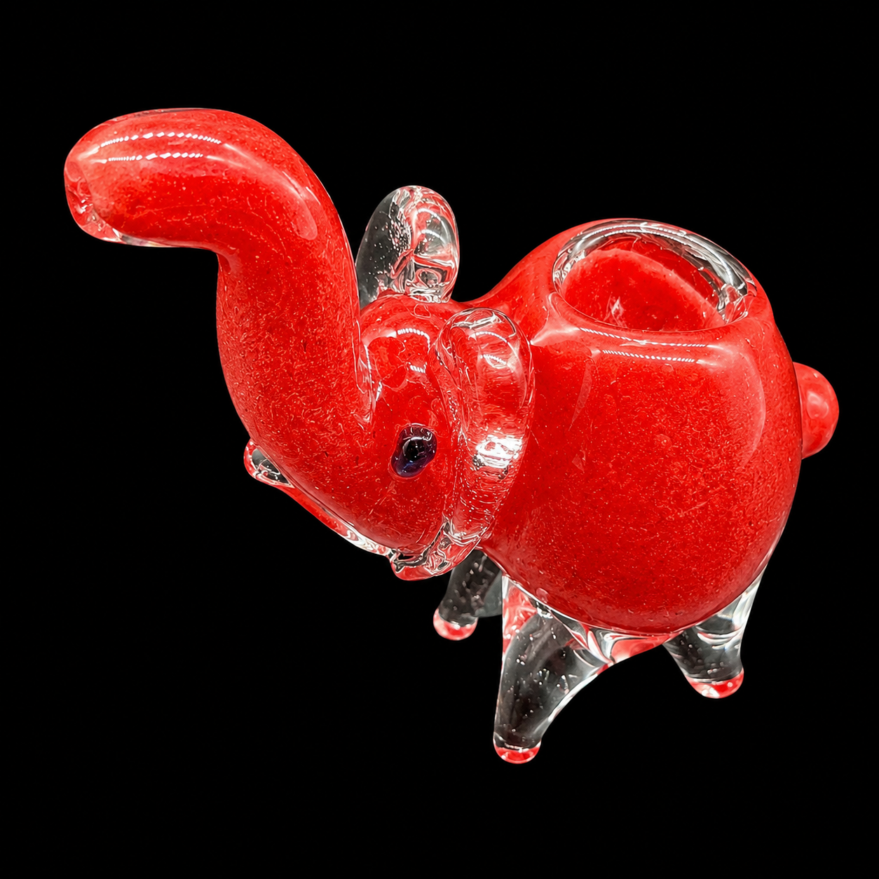 Red glass squirrel figure on a black background