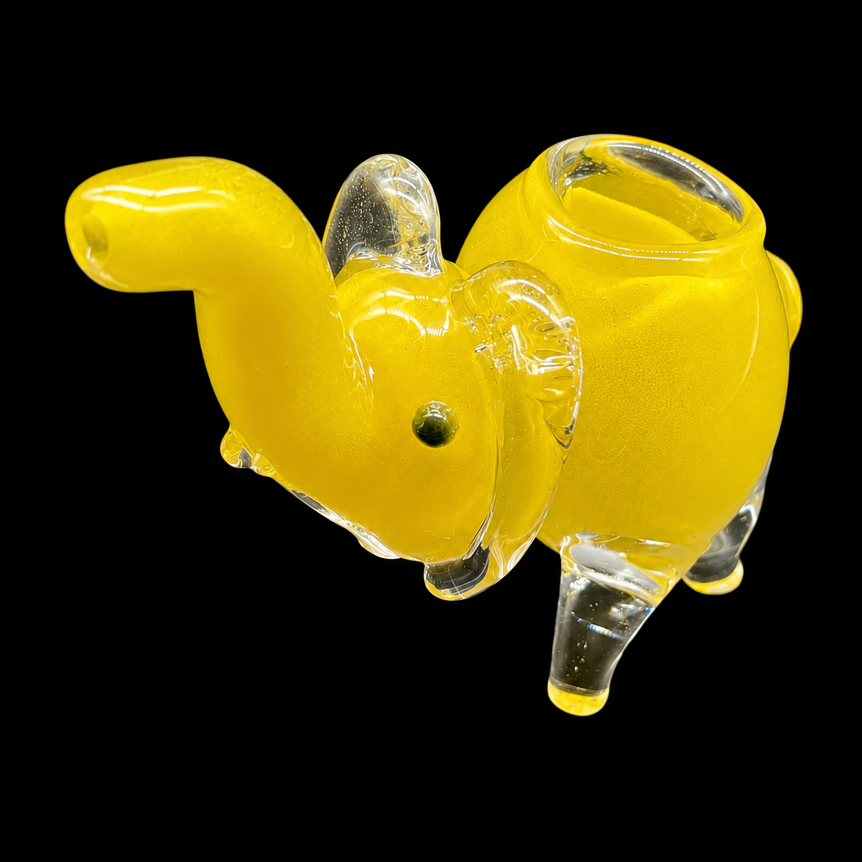 Yellow glass smoking accessory on a black background