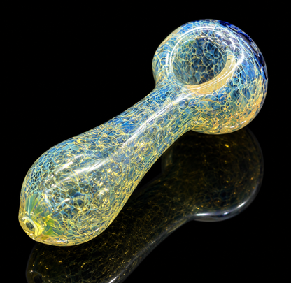 Glass pipe with a textured surface on a black background
