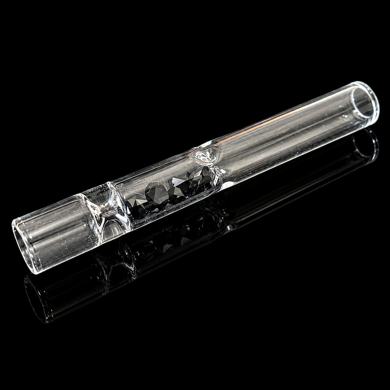 Clear glass smoking pipe on a black background