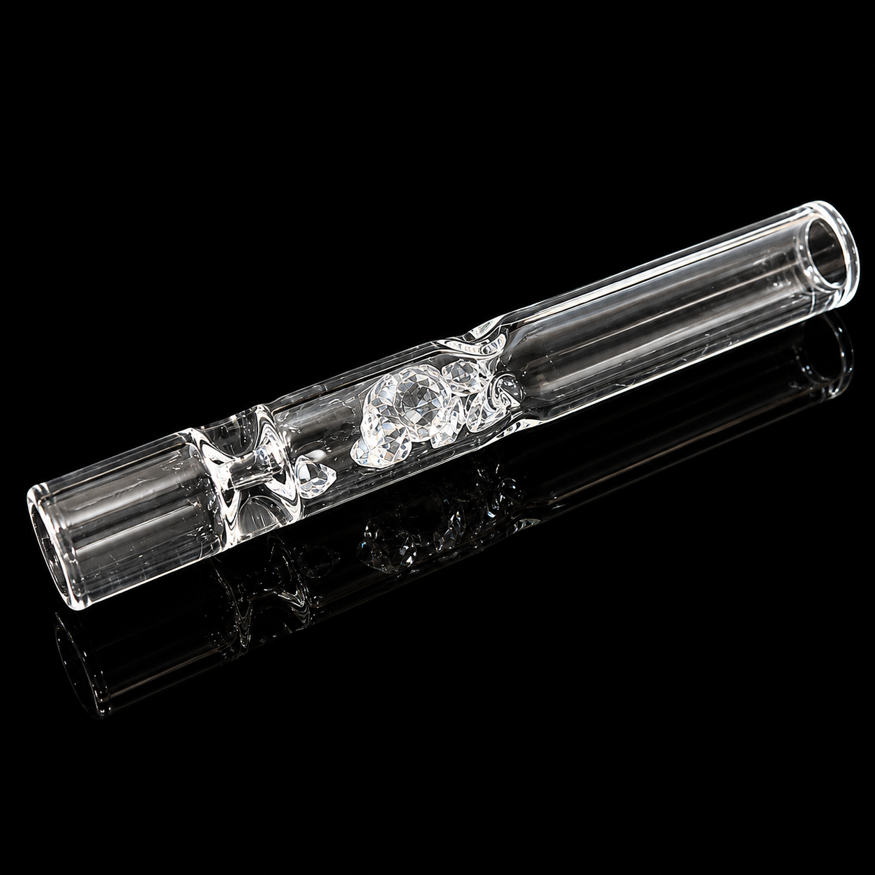 Clear glass smoking accessory on a black background