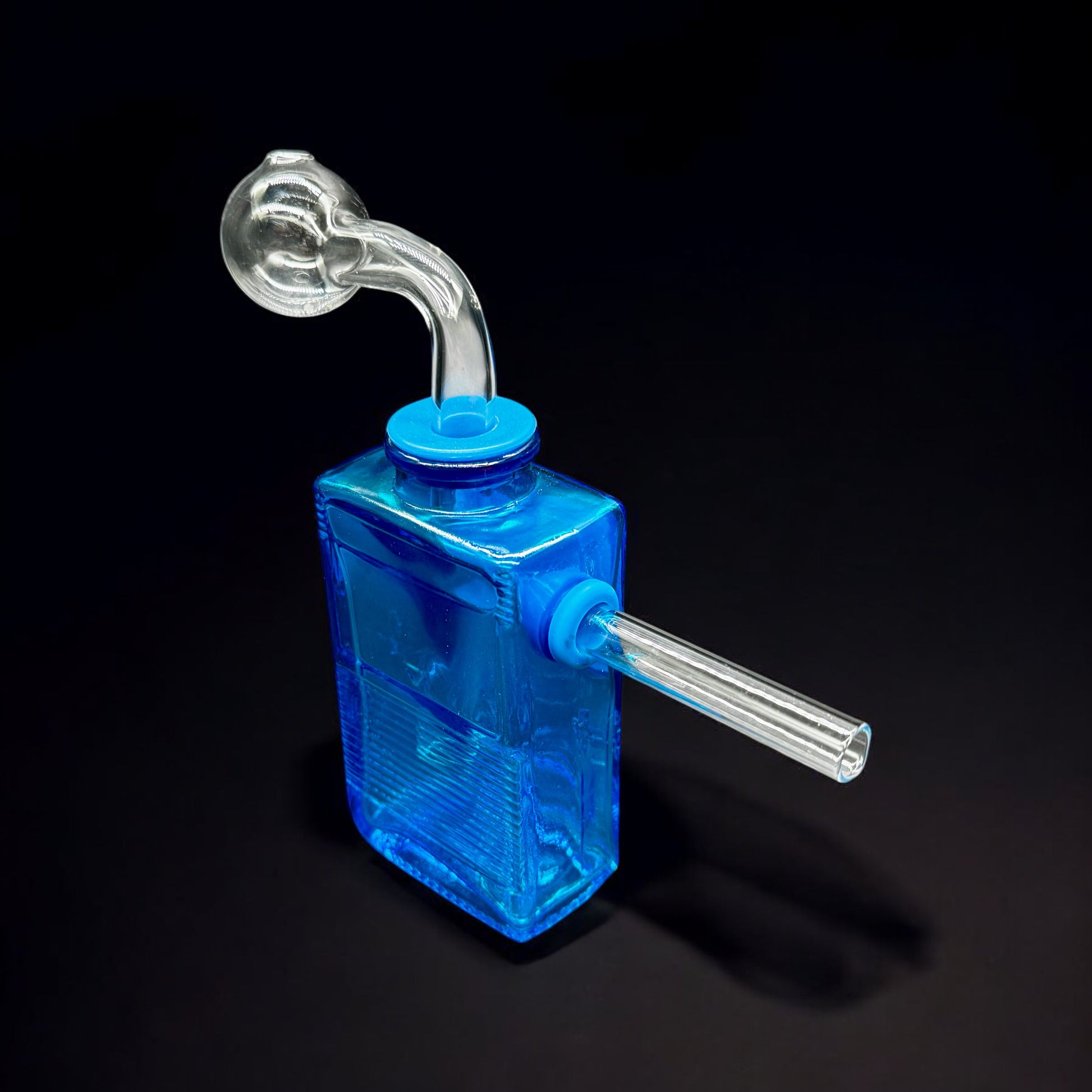 Side view of blue Gameboy-style glass oil burner bubbler with clear angled mouthpiece