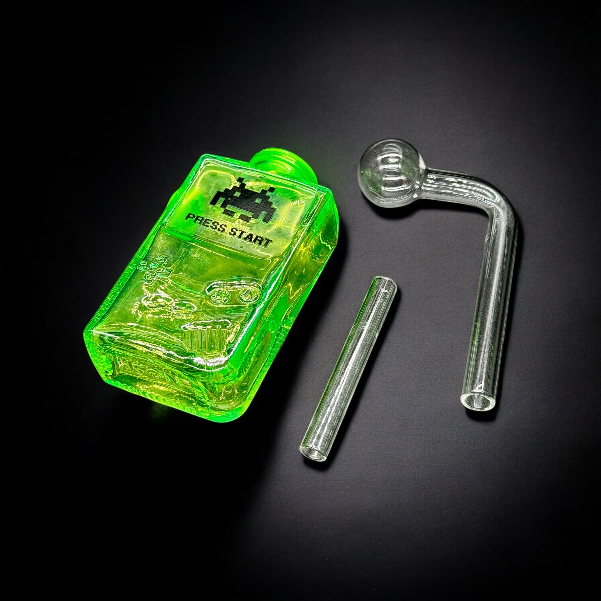 Disassembled view of hot green Gameboy-inspired oil burner glass bubbler showing three separate parts