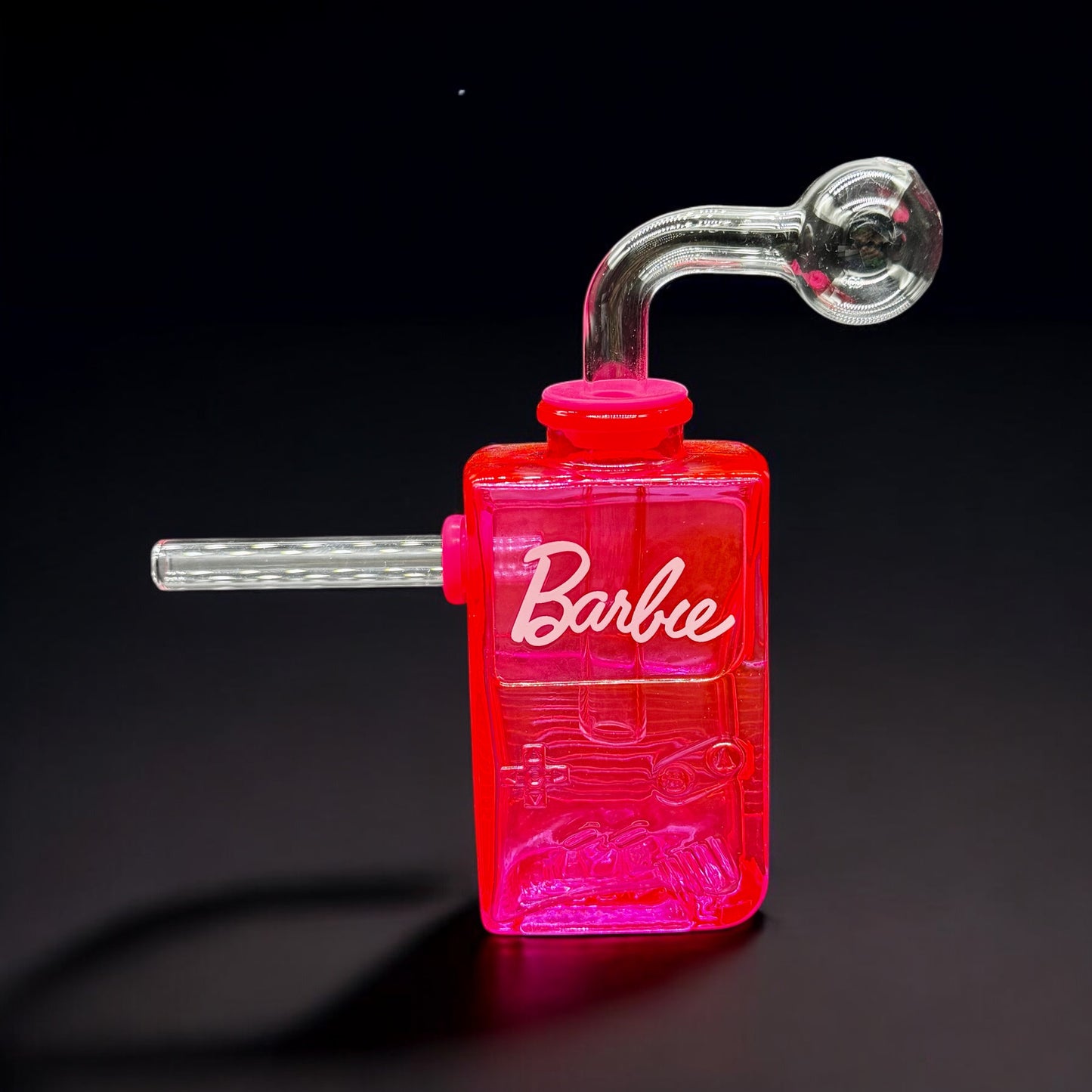 Hot pink Gameboy-style glass bubbler with Barbie-themed label and removable parts