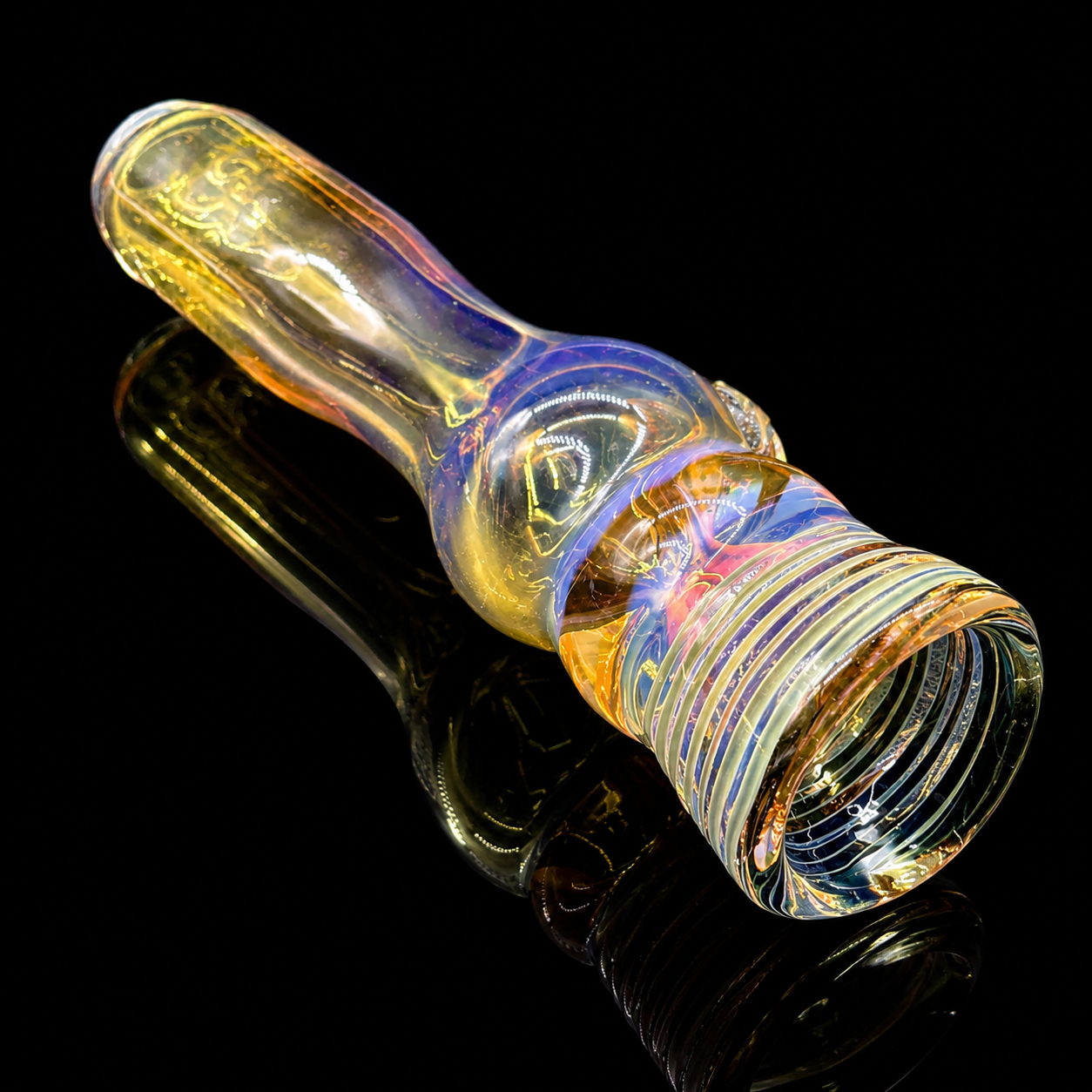 Multicolored glass pipe on a black background