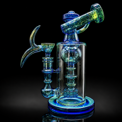 Glass smoking device with blue and green colors on a black background