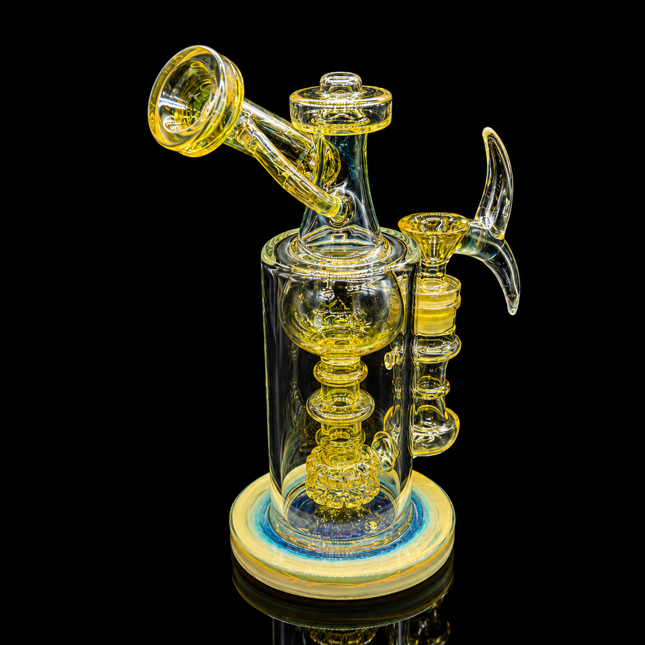 Glass smoking device with yellow accents on a black background
