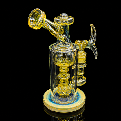 Glass smoking device with yellow accents on a black background