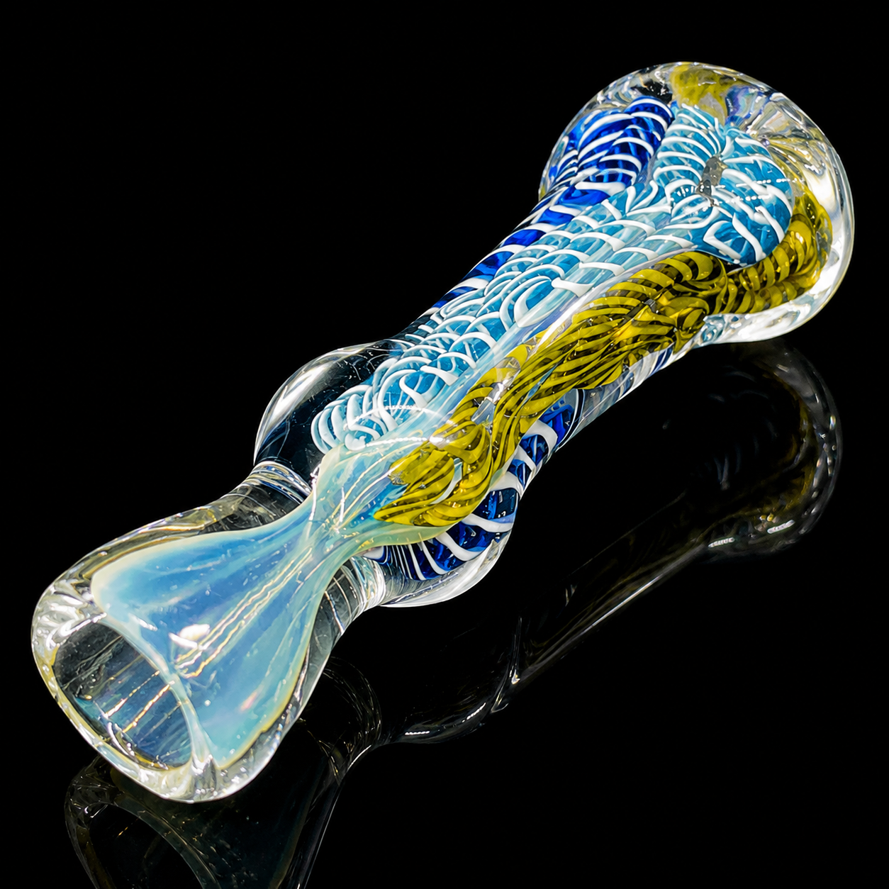 Glass pipe with blue and yellow patterns on a black background