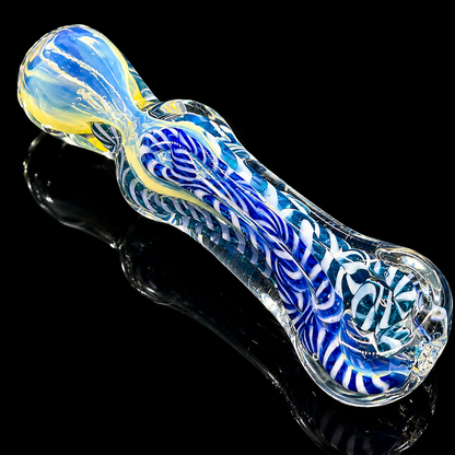 Glass pipe with blue and white swirl design on a black background
