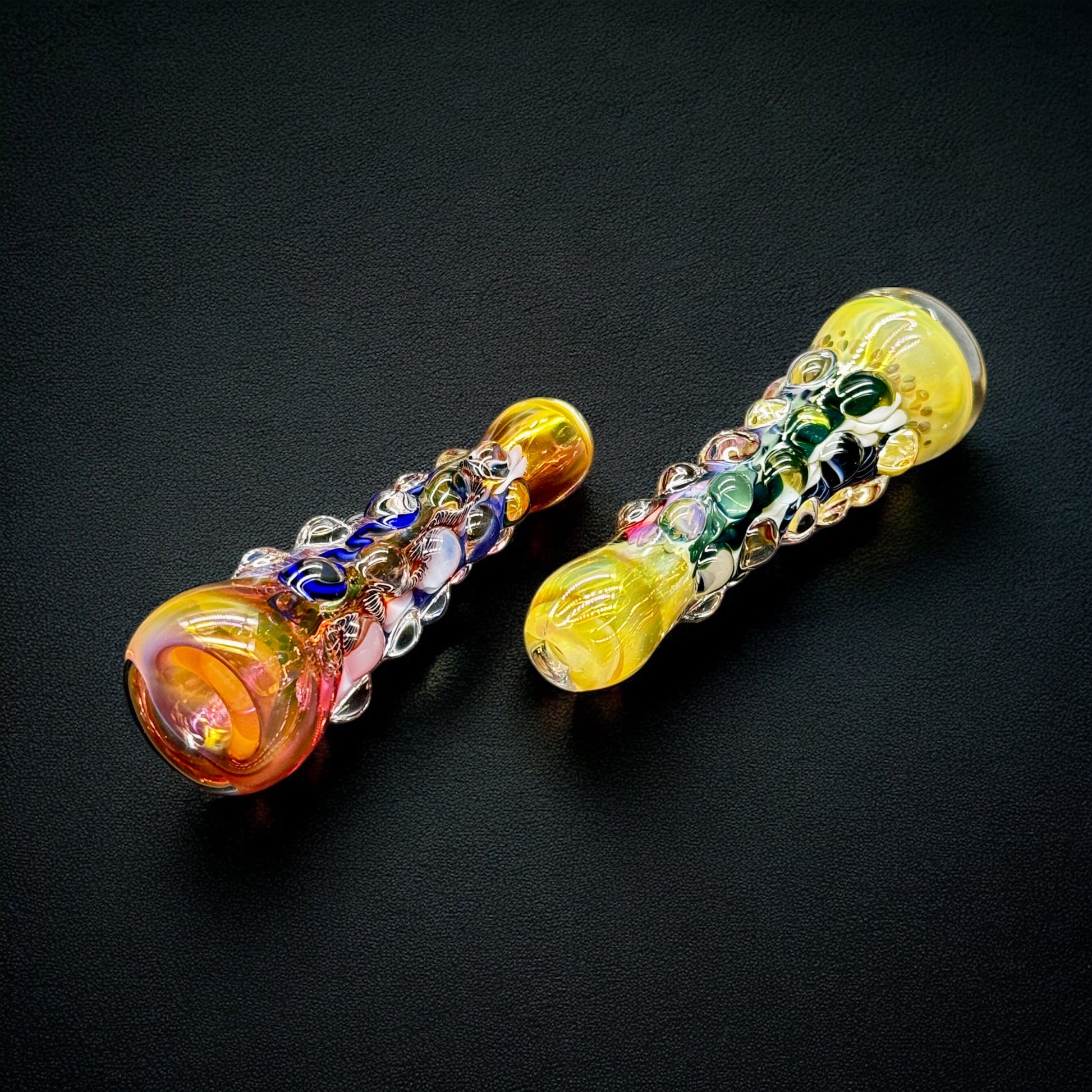 Close-up of fumed chillum pipe with multicolor raised glass bubbles and artistic details