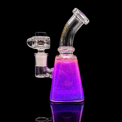 Glass water pipe with purple base on a black background