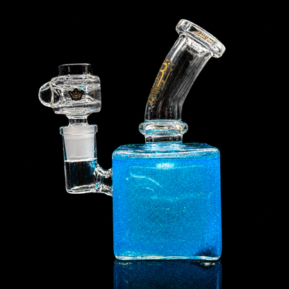 Glass water pipe with blue base on a black background