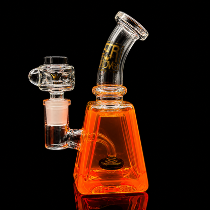 Glass water pipe with orange base and clear top sections on a black background