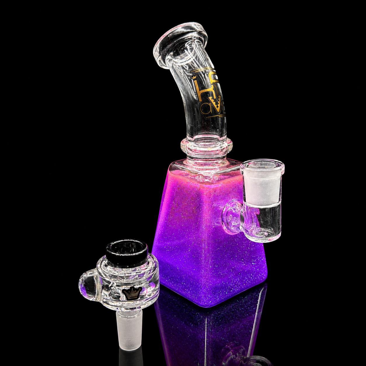 Glass smoking device with purple base on a black background