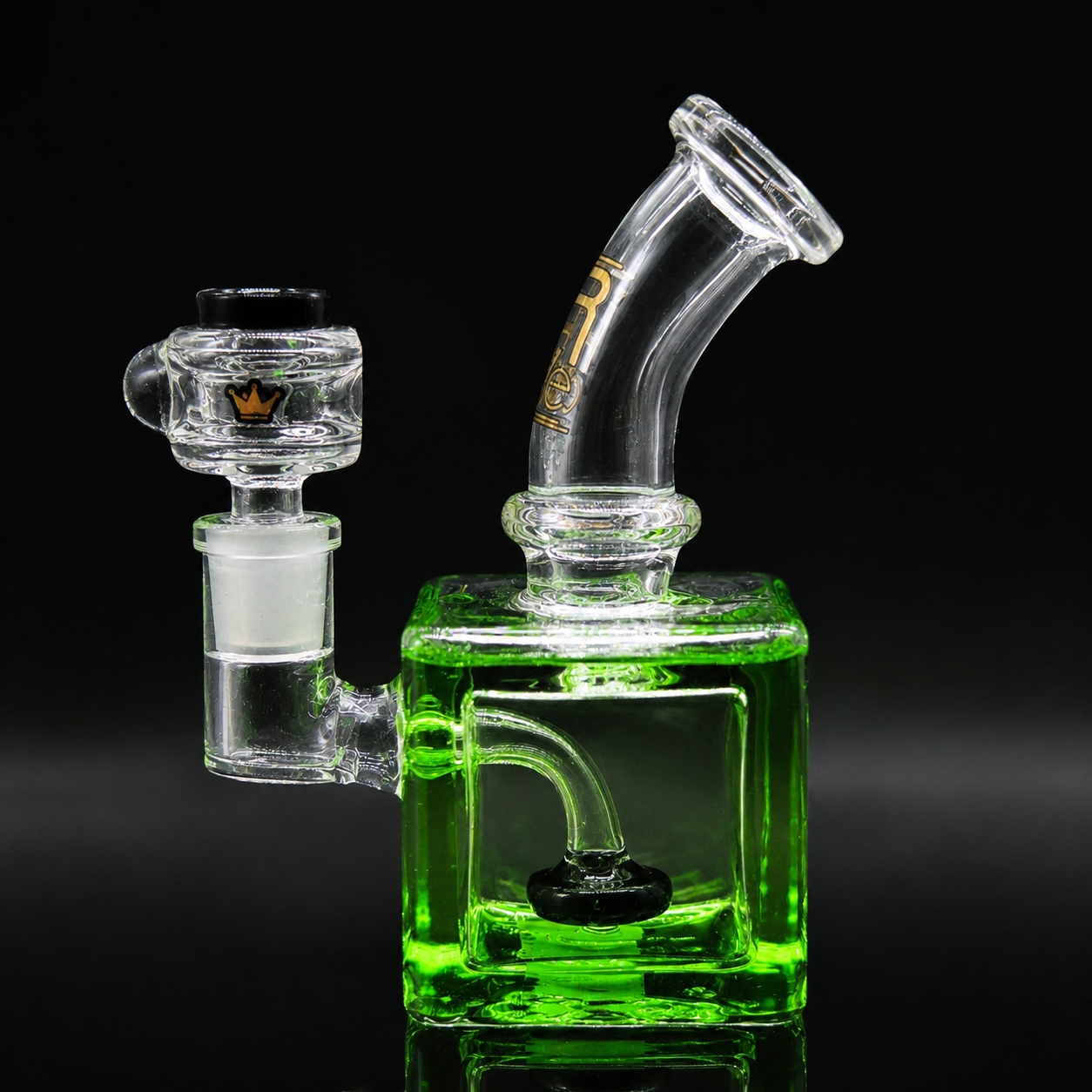 Glass smoking device with green base on a black background