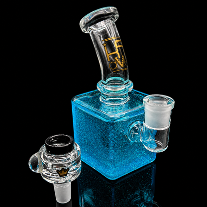 Blue glass water pipe with a logo on a black background