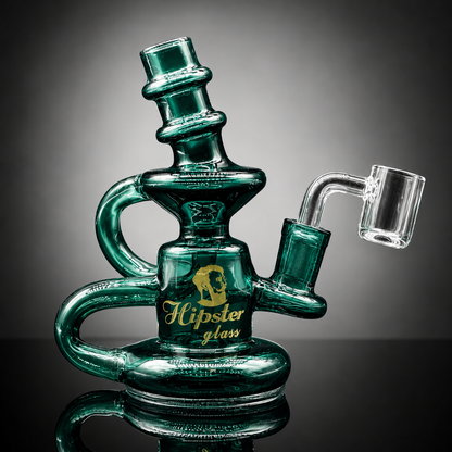 Green glass smoking accessory with 'Hipster Glass' branding on a reflective surface.