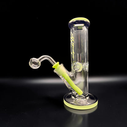 Clear glass water pipe with green accents on a black background