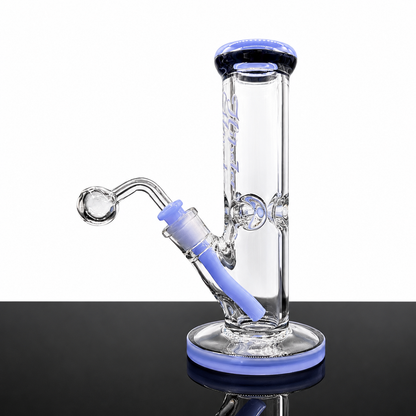 Clear glass water pipe with blue accents on a black surface
