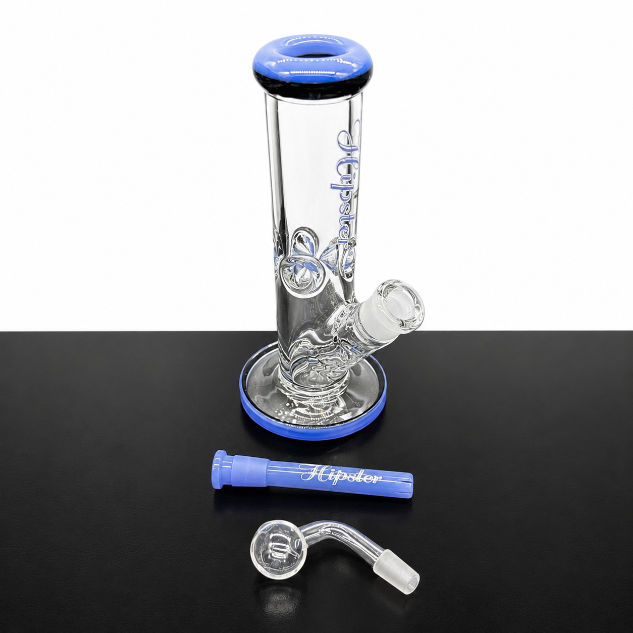 Clear glass water pipe with blue accents on a black surface