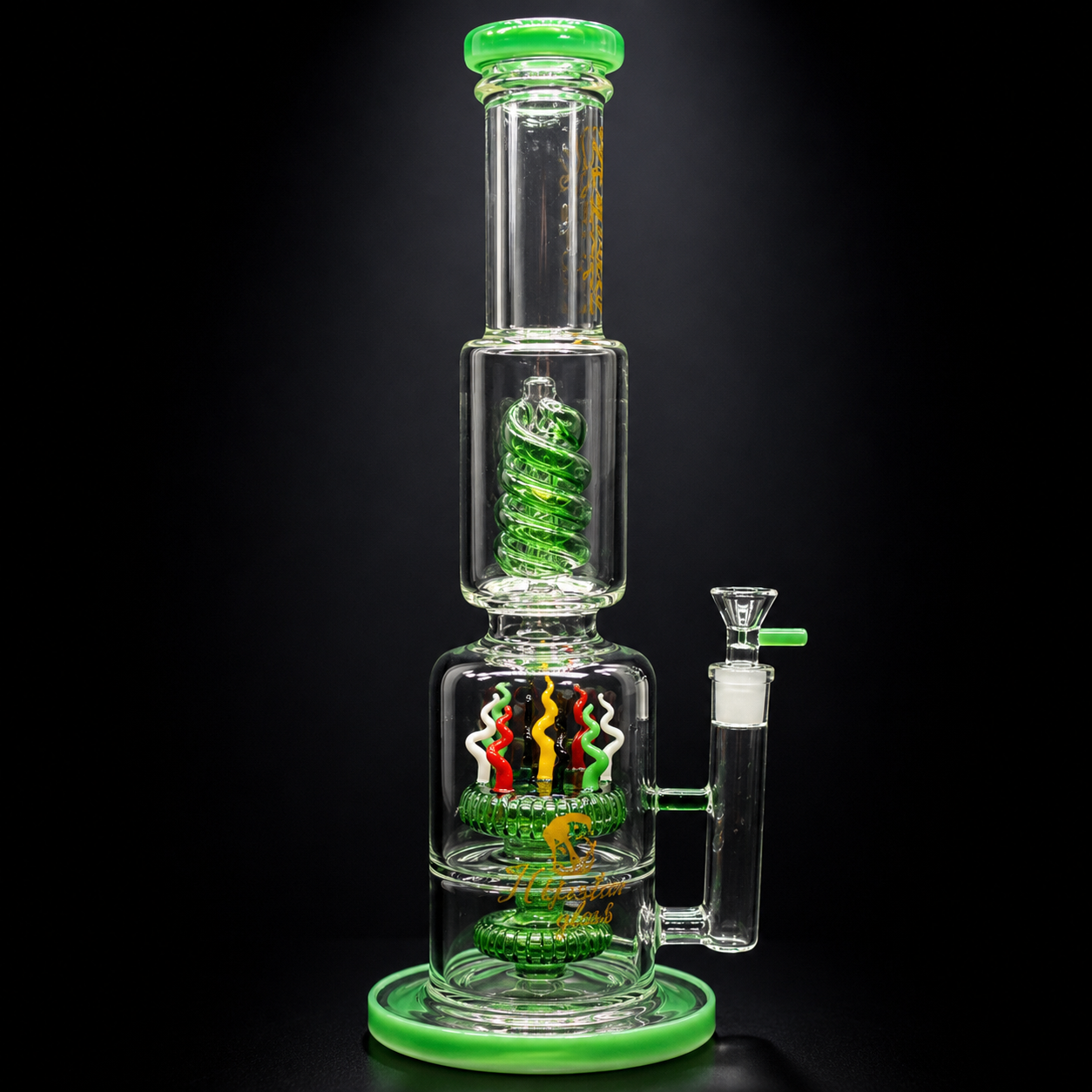 Glass water pipe with green accents on a black background