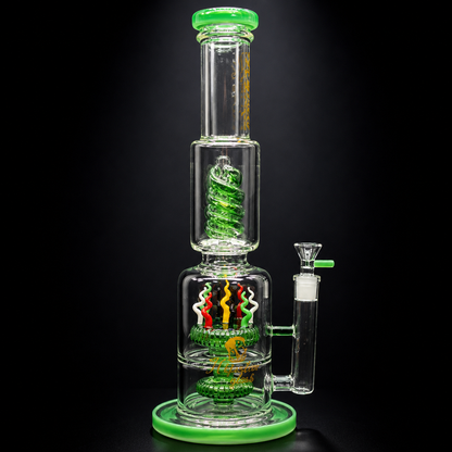 Glass water pipe with green accents on a black background