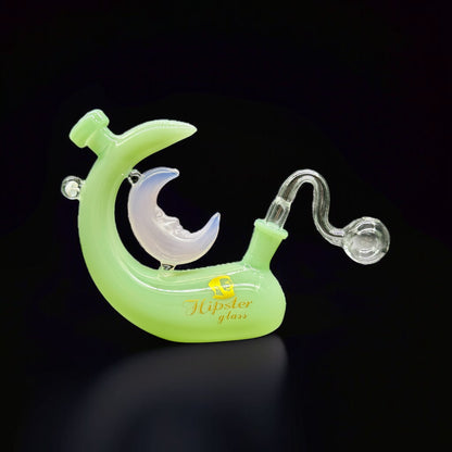 Glass pipe shaped like a crescent moon with a clear chamber on a black background, branded 'Hypster Glass'.