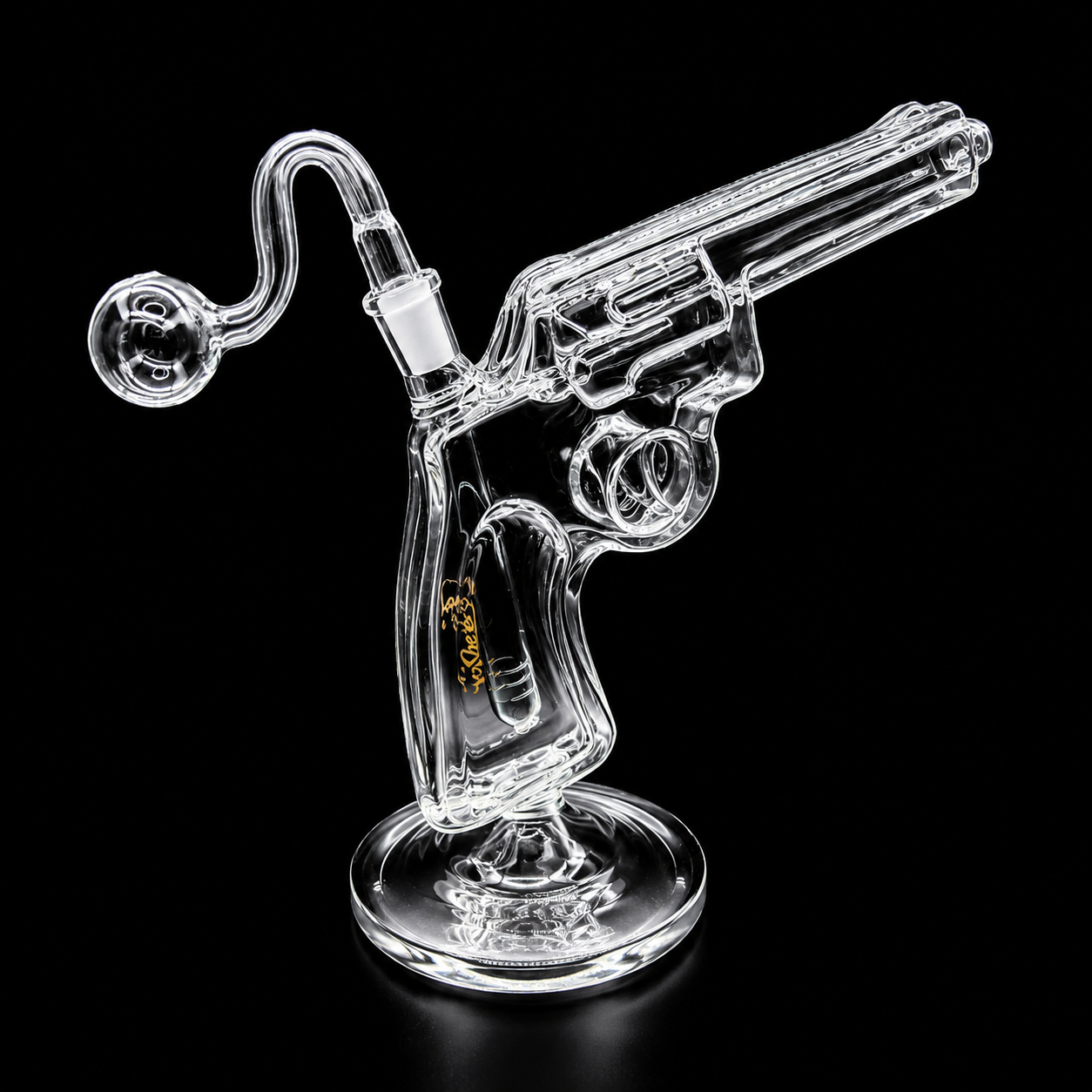 Glass revolver bong on a black background
