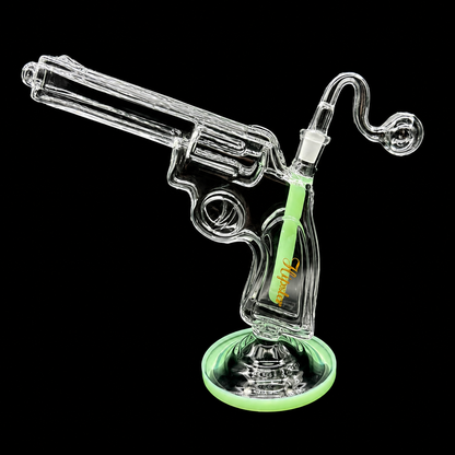 Glass smoking device shaped like a revolver with a green accent on a black background