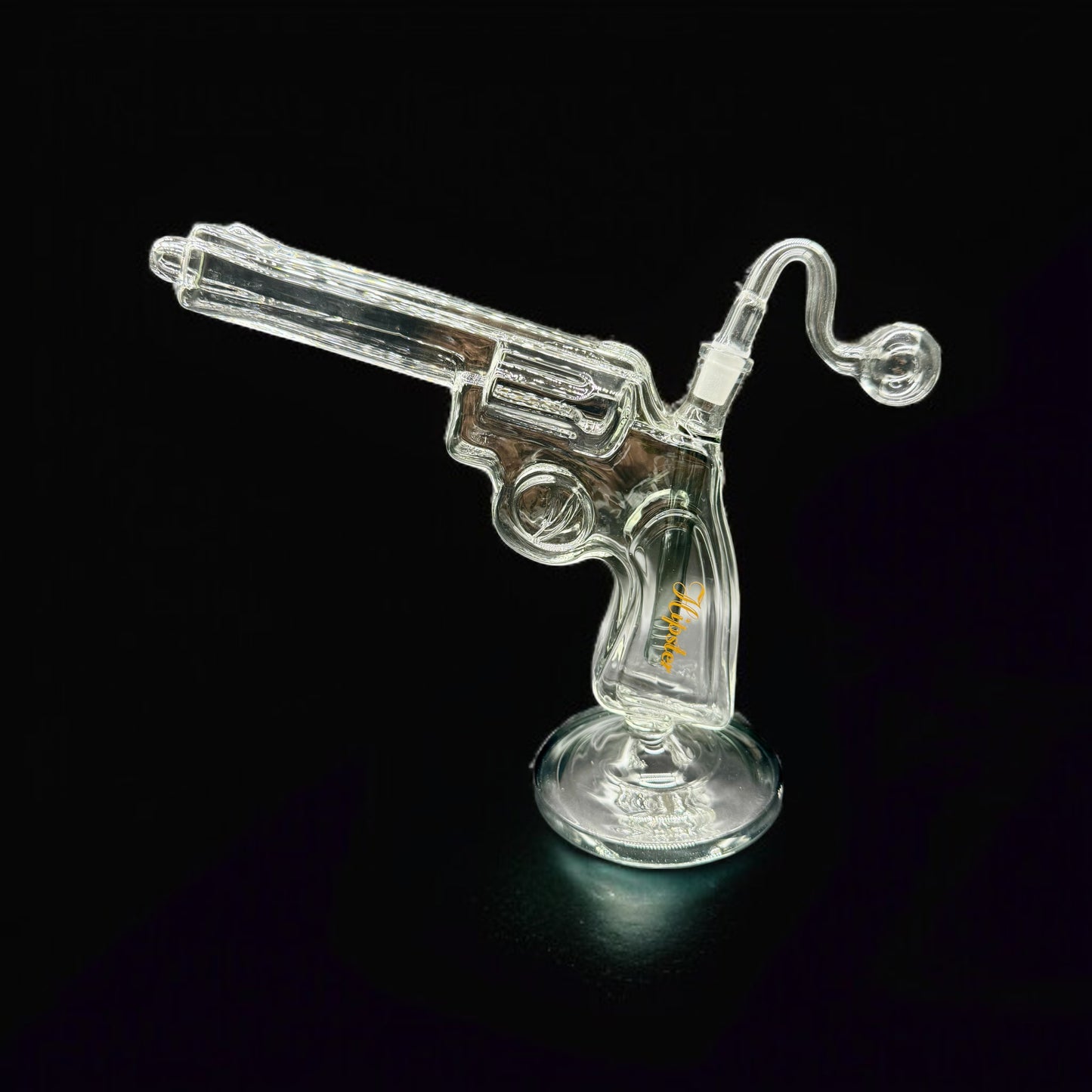 Clear glass gun-shaped pipe on a black background